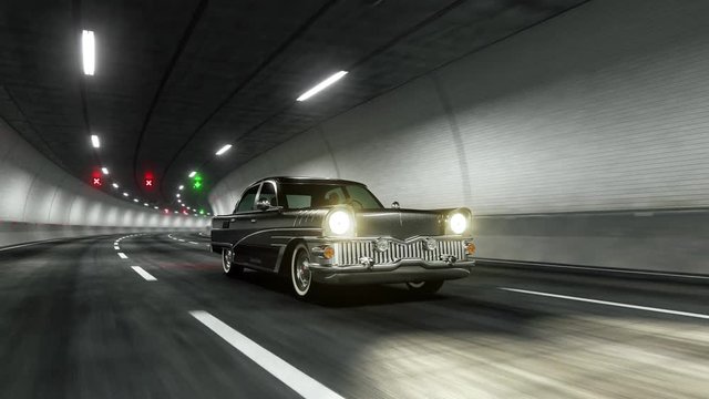 Oldstyle classic car rides through tunnel