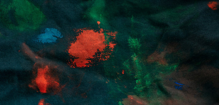 The texture of the painting. Stains of paint on dark blue denim. - Powered by Adobe