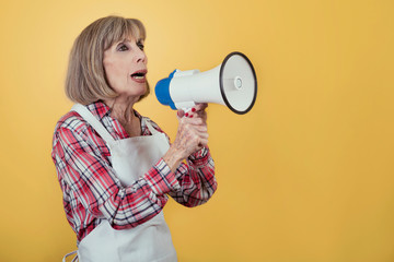 Portrait of Senior woman with a megaphone