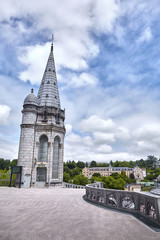 Fototapeta na wymiar Lourdes, France: The Sanctuary of Our Lady of Lourdes is one of the largest pilgrimage centers in Europe. Detail of the architecture of the basilica