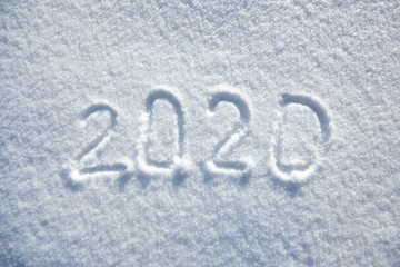 winter inscription 2020 New Year background, text on snow surface