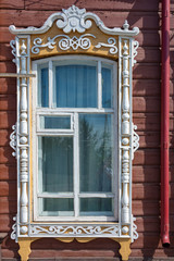 Mariinsk, a fragment of the facade of an old wooden house