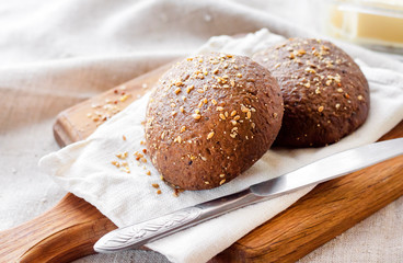 Homemade rye buns with linseeds, sesame and white poppy seeds