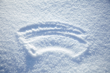 erased inscription on the snowy surface, winter background