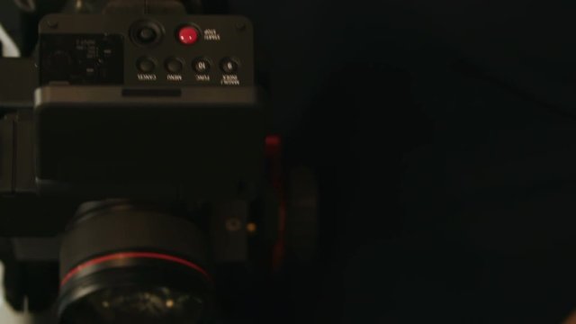 Cameraman is shooting objects by professional camera
