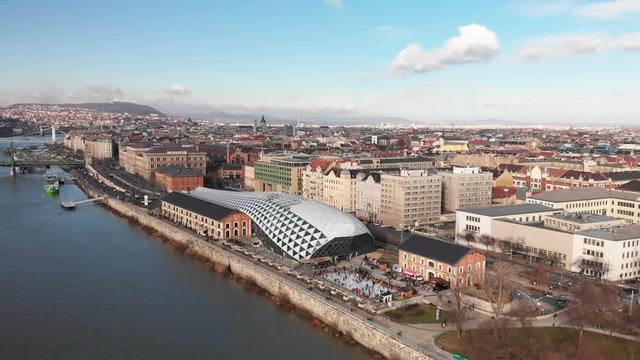 Aerial shot flying over the Balna Cultural Centre near The Danube, a beautiful river running through Budapest, Hungary.