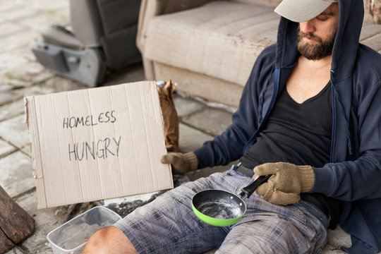 Homeless beggar in the street