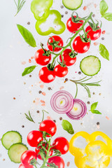 Vegan healthy food concept. Ingredients cooking spring vitamin salad. Fresh vegetable simple pattern, layout with tomatoes, onions, herbs and spices on white background. Top view banner copy space