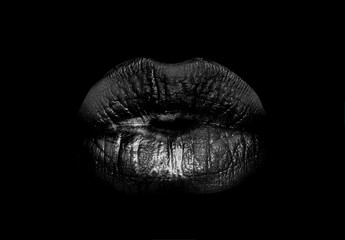 Black lips. Mouth icon. Woman lips isolated on black background. Luxury dark cosmetics.