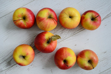 bright apples on a white wooden table