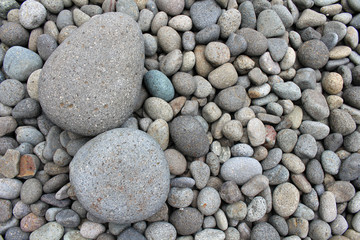 Big stones among smaller pebbles, in the garden.