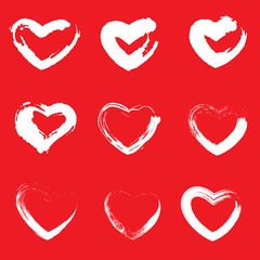 Icon set of red heart .Painted Hearts from Grunge Brush Strokes. Collection of love symbols for Valentine card, banner. texture design elements. Isolated on red background. Vector illustration