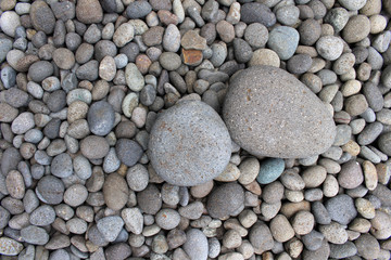 Big stones among smaller pebbles, in the garden.