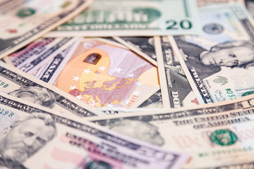 Closeup lot of american dollar and euro cash banknotes. Concept leap, fall, rate, currency exchange, debt, profit, loss, sanctions, appreciation of goods