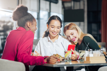 Businesswomen having much fun while spending evening together