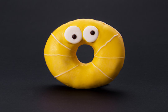 Yellow Glazed Donuts With Funny Eyes