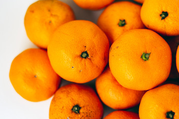 Fresh whole mandarin oranges background , top view.