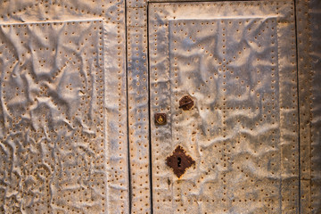 Detail take of a studded door