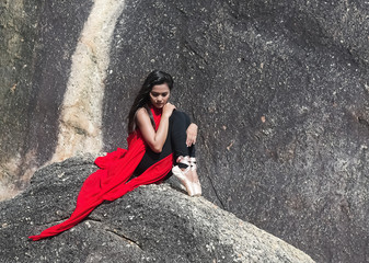 The beauty lady wearing red suit and ballet shoes,point toe down and turn face down,posing ballet pattern