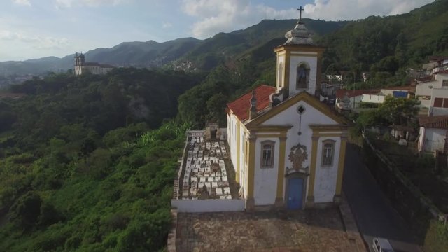 Aerial flight past the cross on the top of Igreja Nossa Senhora das Merc�s e Miseric&atilde;rdia