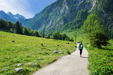 Young woman Hikers on the trail in the Scenic summer landscape view in the Alps, National park...