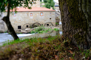 Fototapeta na wymiar A picture with a Tilt and shift lens of a mill-house in Vilar de Mouros, Portugal.