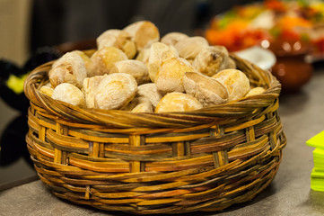 Wooden basket with white buns