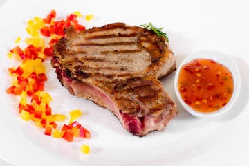 Steak on a plate on a white background
