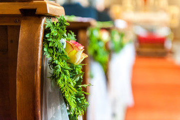 Floral ornament on wooden bench in church