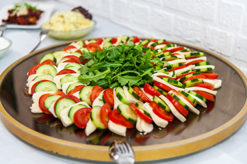 Italian appetizer on a wooden plate