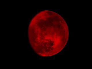 Red moon illustration with black background
