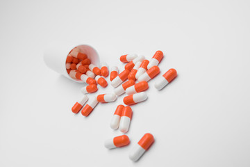 Orange Pills on a white background, medical pills