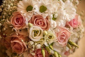 beautiful wedding bouquet pastel pink rose and white foliage 