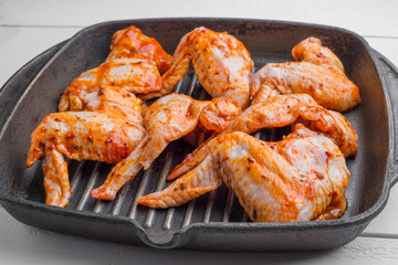 Raw chicken wings marinated