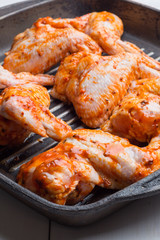 Raw chicken wings marinated