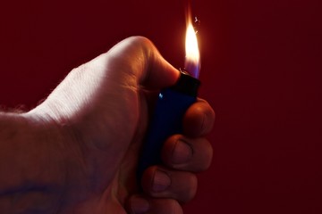 lighter in the hand of an arsonist