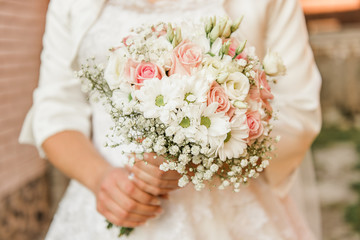 beautiful wedding bouquet pastel pink rose and white foliage 