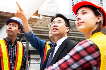 Engineering and customer holding home construction paper for work concept.