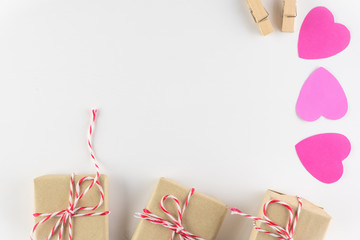 Gift box and Hand-made pink love hearts isolated on white wooden background, Happy valentine's day. holiday background, Flat lay, top view, copy space