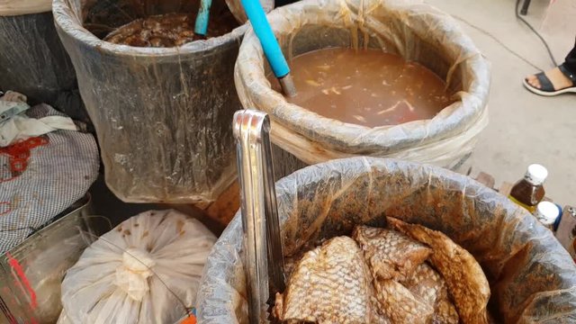 pickled fish in local market , Thailand ,traditional Thai style raw preserved fish, thai accent is Pla-ra 