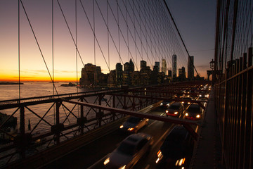Obraz na płótnie Canvas Busy traffic in New York City, Manhattan, Brooklyn Bridge