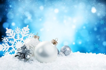 Fototapeta na wymiar Christmas balls in snowflakes on background