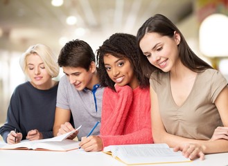 Four Young students studying subject on background