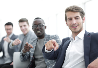 group of successful young men pointing their fingers at you