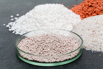 Mineral fertilizers granules in glass jar