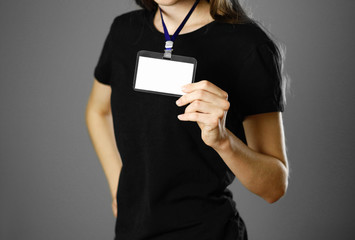 Girl holding a badge. Close up. Isolated background