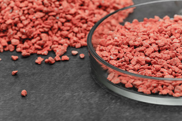 Mineral fertilizer with phosphorus in red with chemical glass