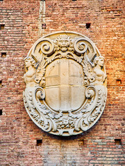 Coat of Arms of Milan on a wall of the Castello Sforzesco, Sforza Castle. Milan, Lombardy, Italy.