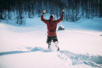 man jumping in snow