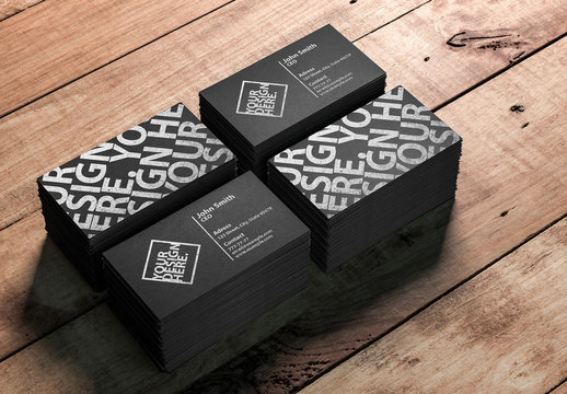 4 Stacks of Business Cards on a Wooden Table Mockup